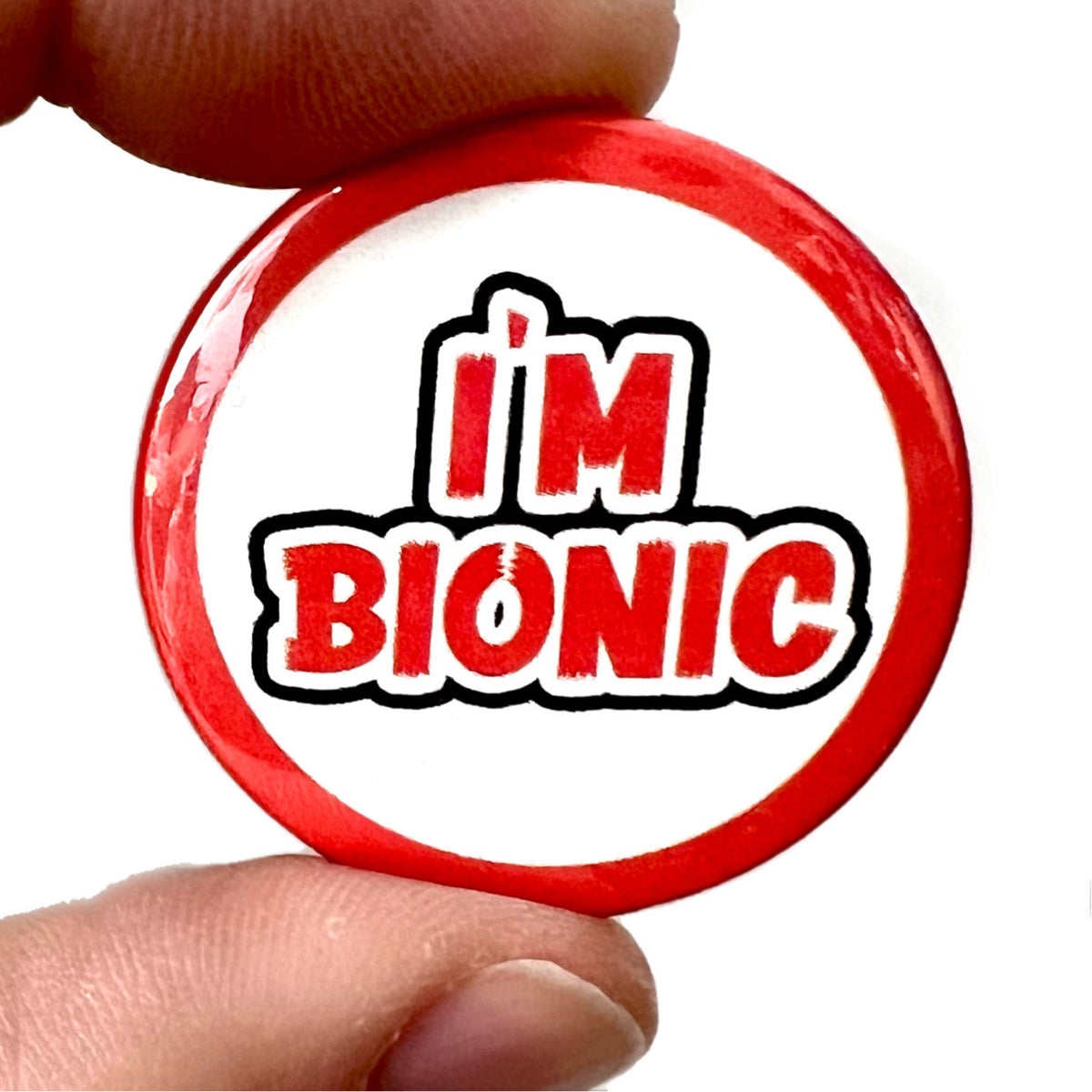 Bionic Tag I'm Bionic Button Pin Badge – Bite Your Granny